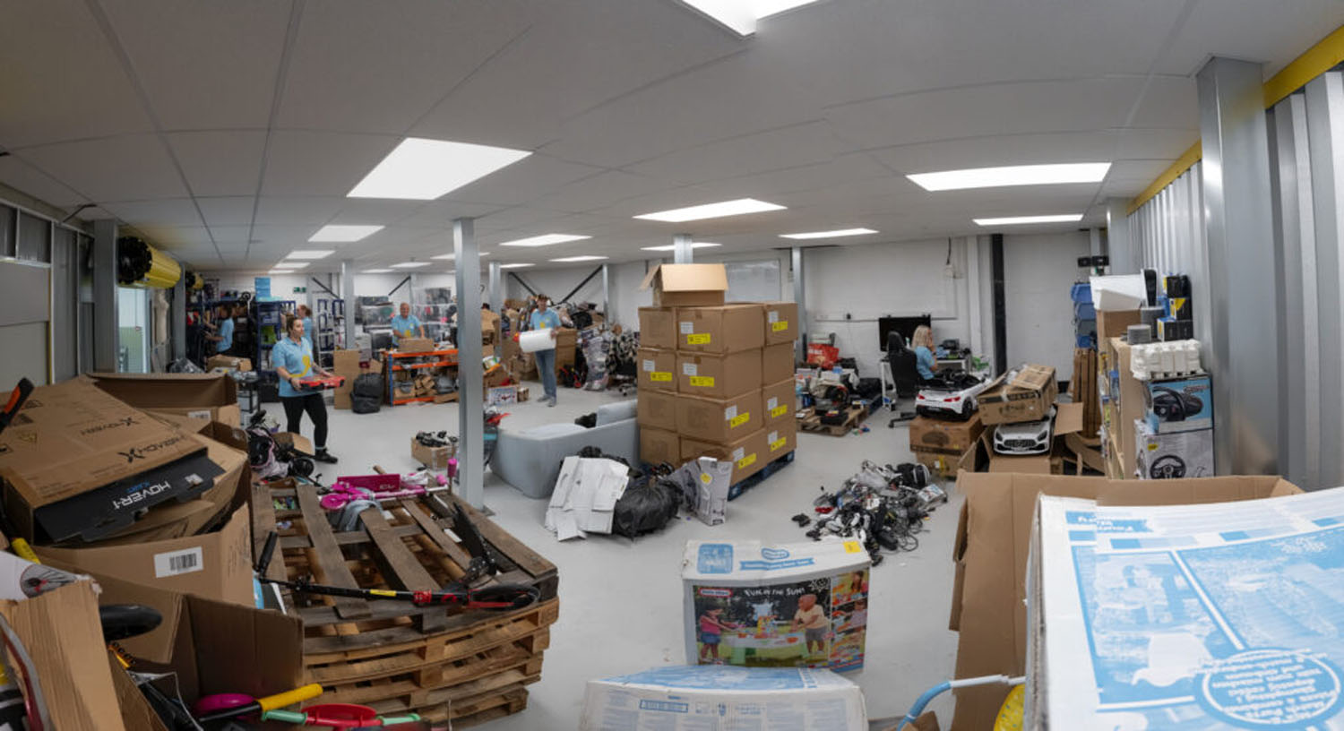 Large indoor storage room filled with a business customer's stock and equipment