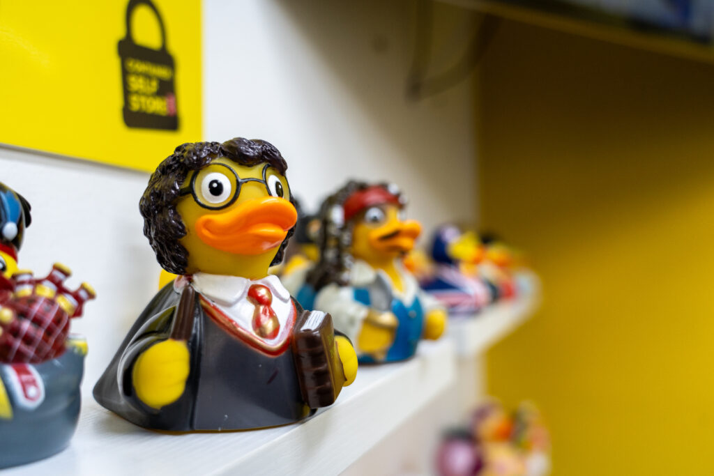 Shelf of collectable rubber ducks in the on-site Duck Shop